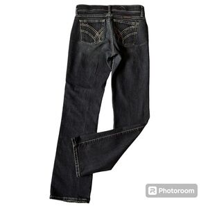 Women’s wranglers bling pocket jeans in a size size 3/4 x 32 dark wash western